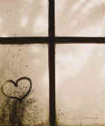 heart and cross in the window